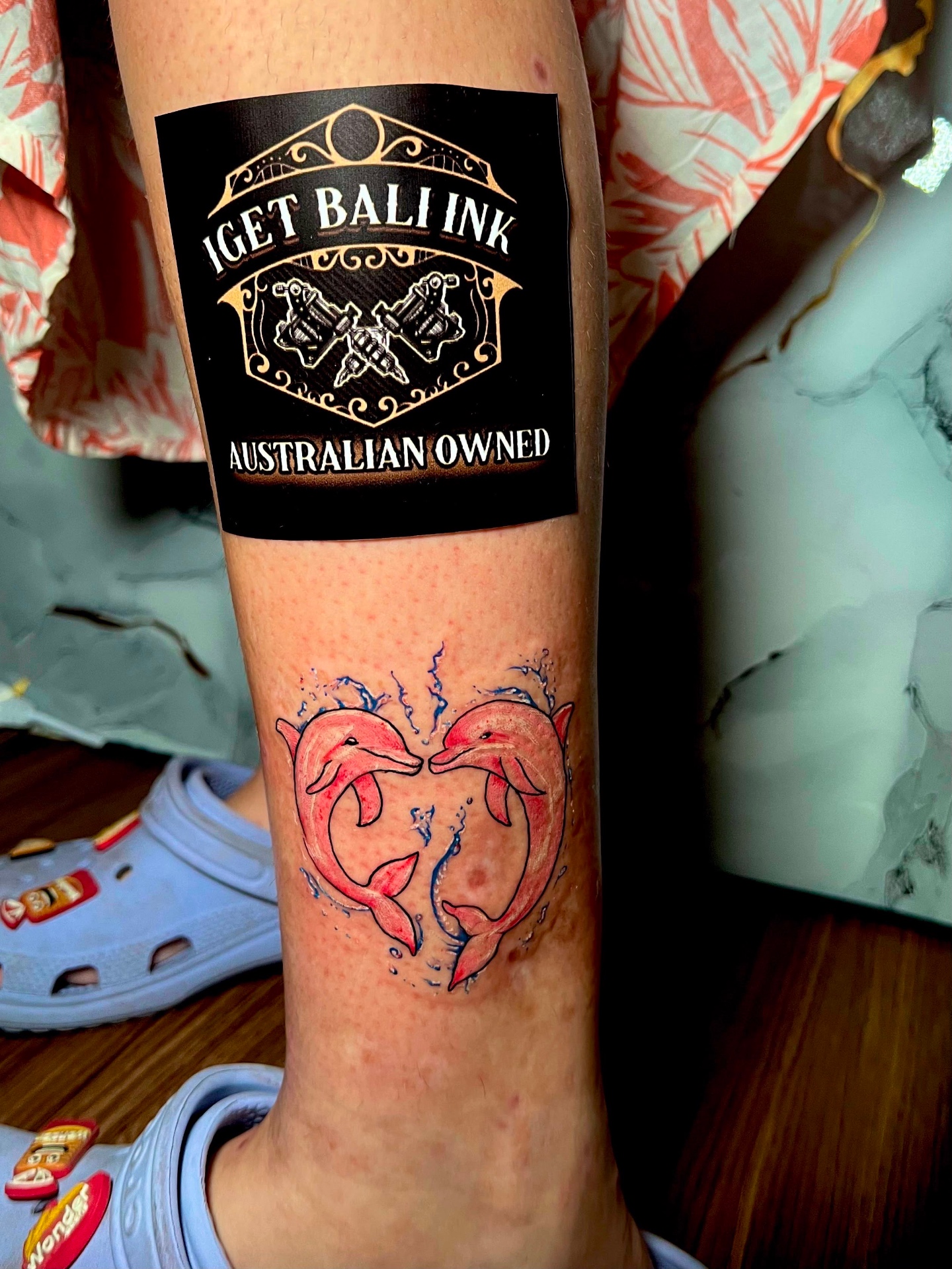 Colour dolphins forming a heart on the calf