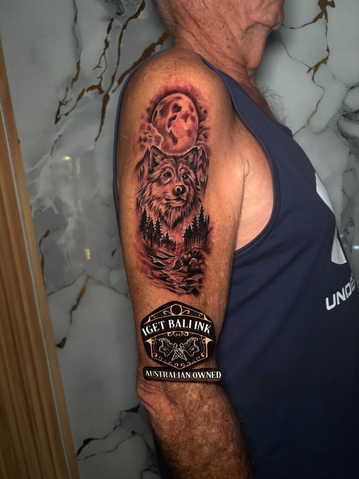 Realistic wolf with full moon and forest half sleeve