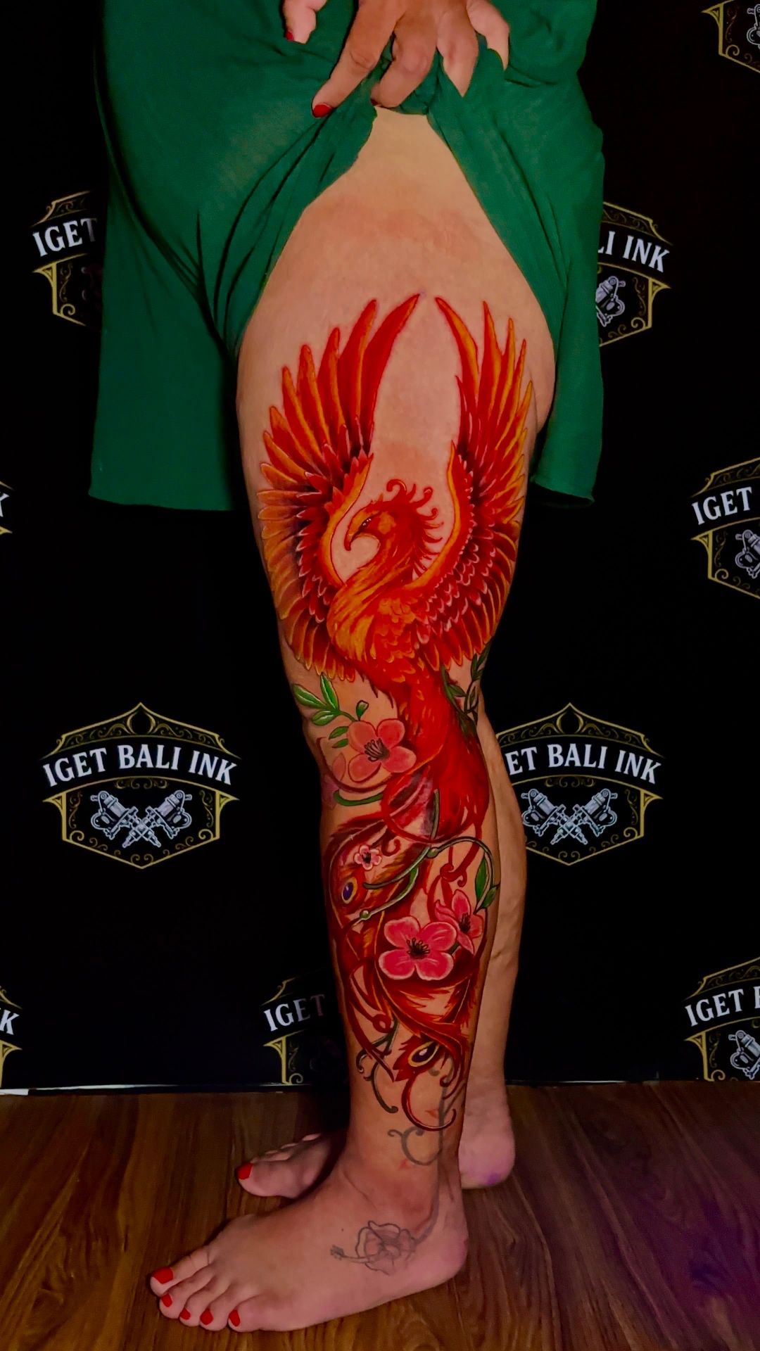 Vivid colour phoenix and cherry blossom full leg tattoo