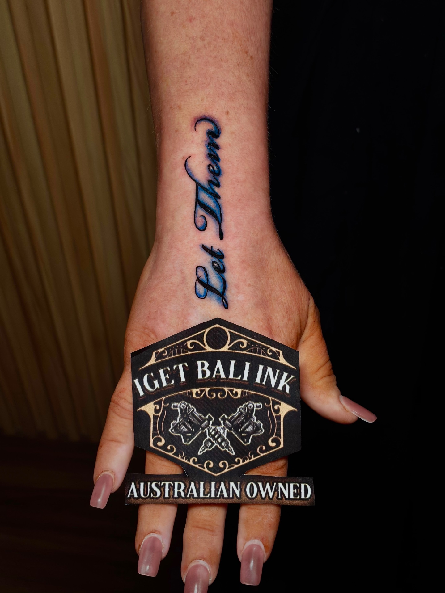 Let Them script lettering on the hand