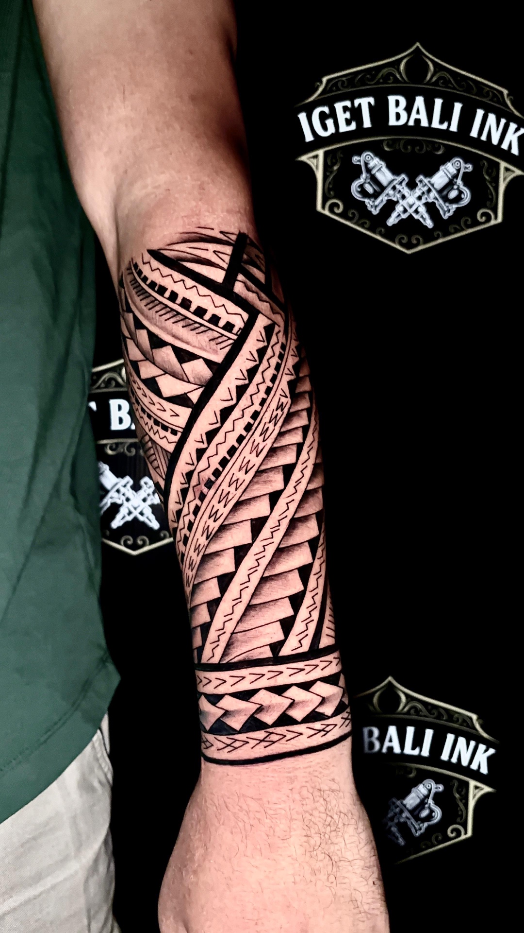 Polynesian tribal forearm sleeve with geometric patterns
