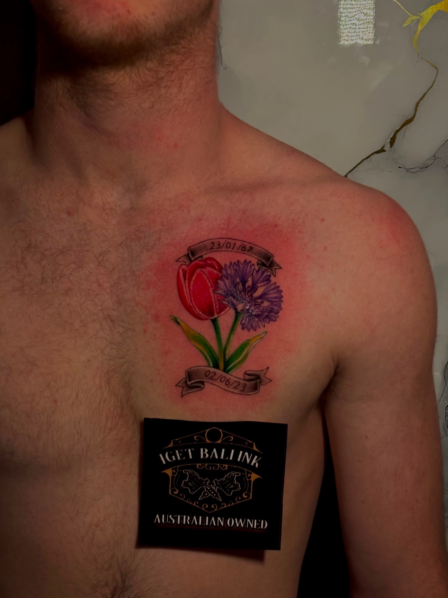 Colour tulip and cornflower memorial chest tattoo