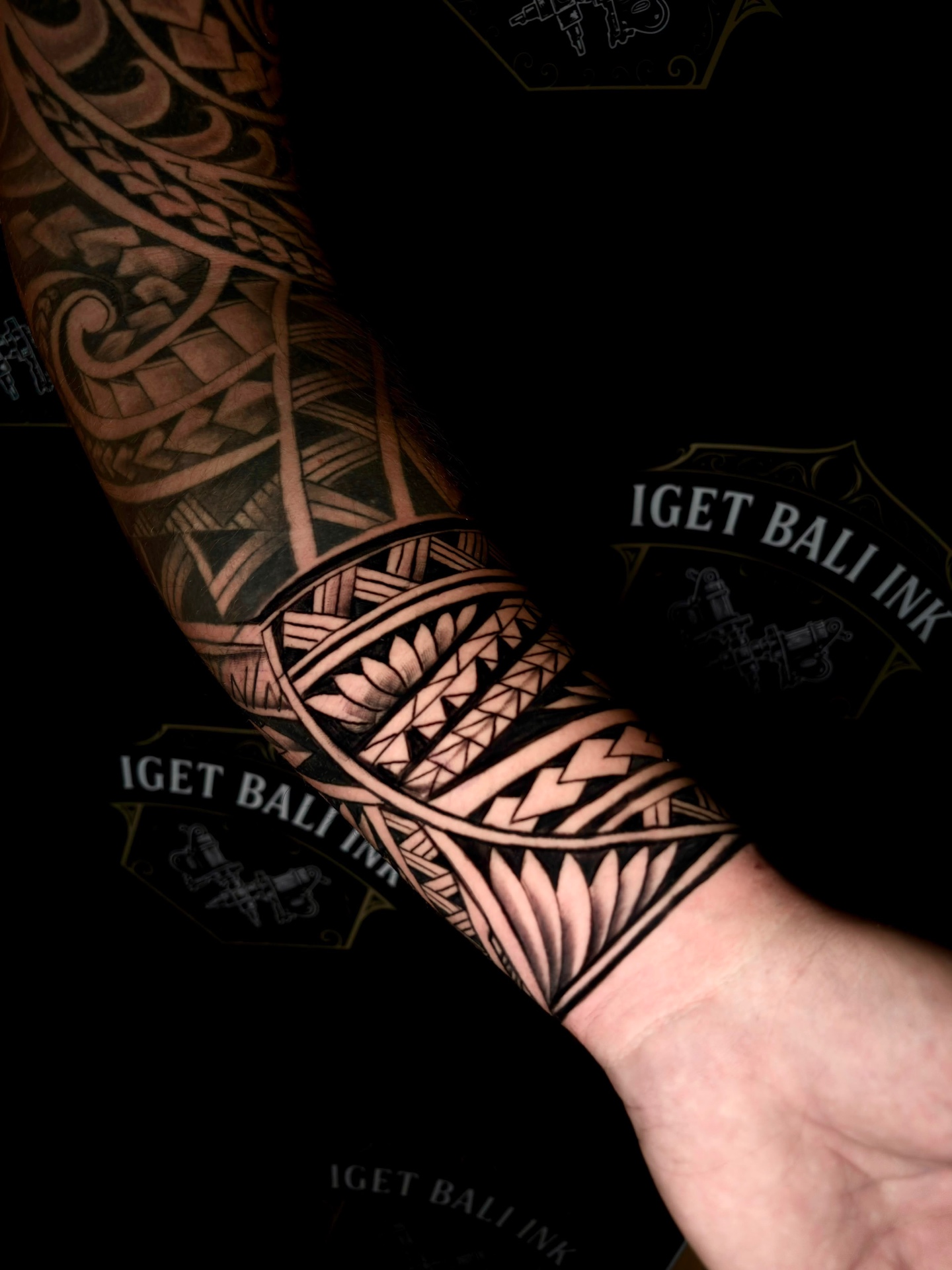 Polynesian tribal forearm band with lotus patterning