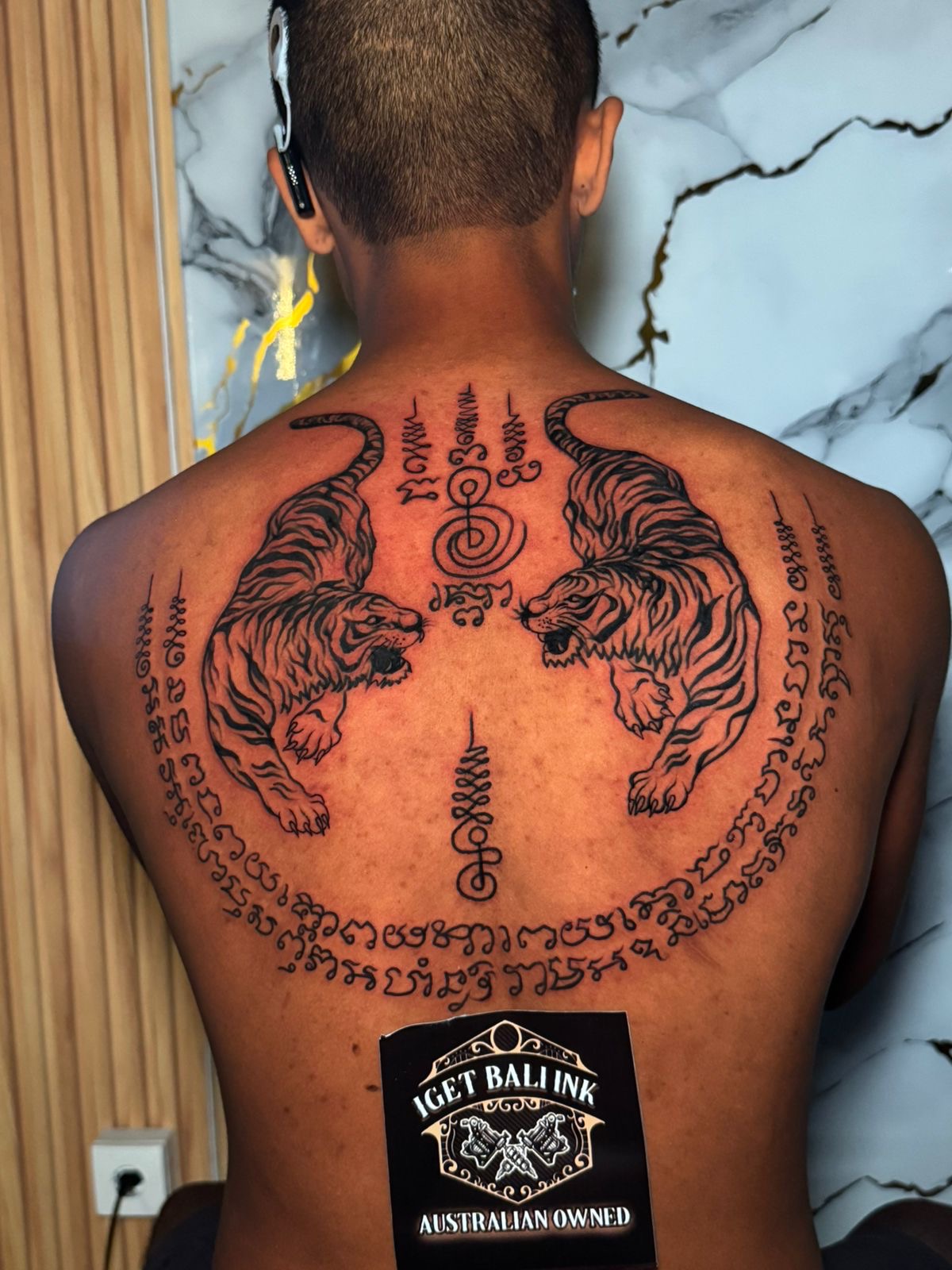 Sak Yant twin tigers back piece with script