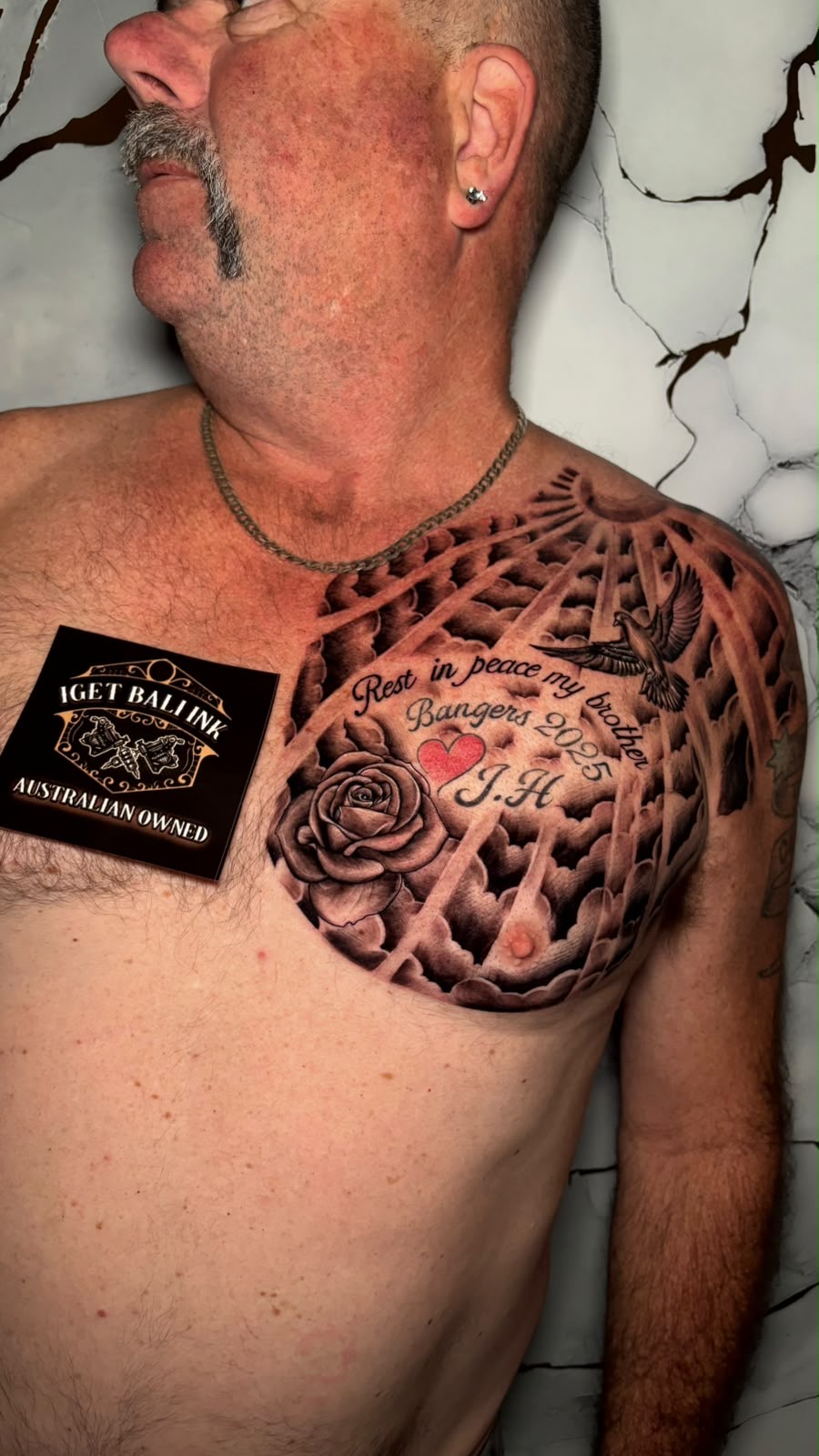 Memorial chest piece with clouds, rose and dove lettering